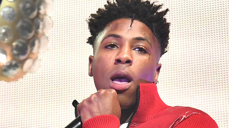 YoungBoy Never Broke Again holding mic