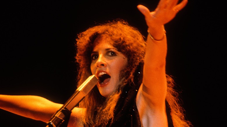 Stevie Nicks singing in microphone