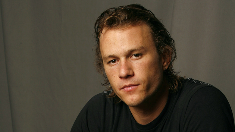 Heath Ledger staring black shirt