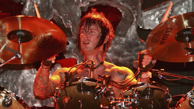 Jimmy Sullivan playing drums shirtless