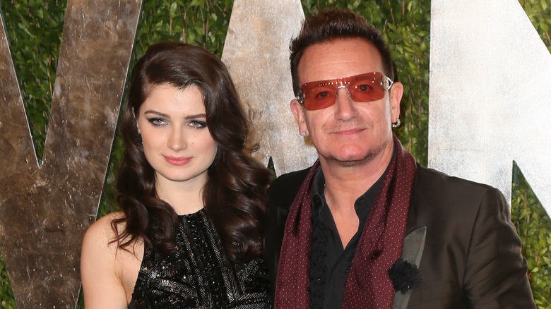 Eve Hewson and Bono smiling and posing for a photo