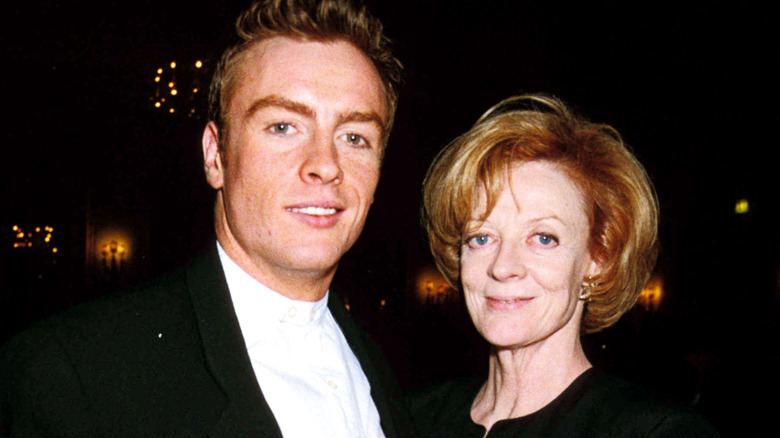 Toby Stephens and Maggie Smith smiling and posing for a photo