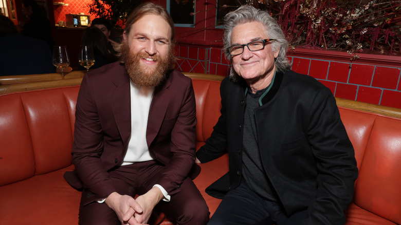 Wyatt Russell and Kurt Russell sitting on a couch together