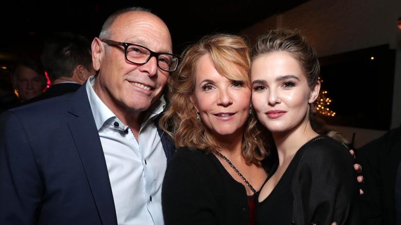 Howard Deutch, Lea Thompson, and Zoey Deutch smiling and posing for a photo