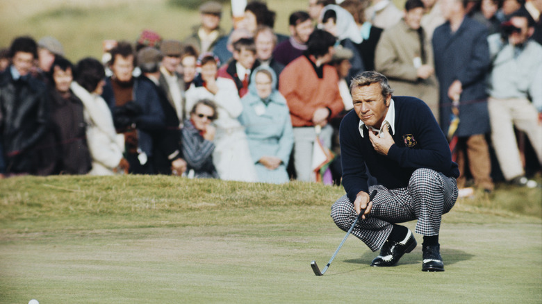 Arnold Palmer crouching