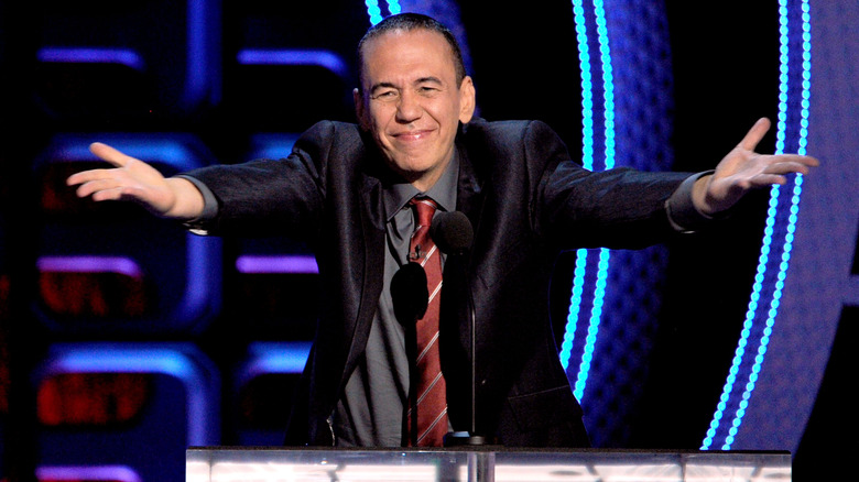 Gilbert Gottfried standing at a podium