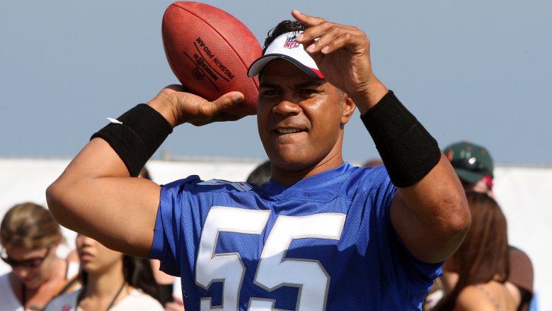 Junior Seau throwing football