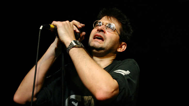 steve albini holding microphone