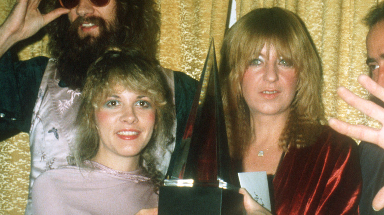 Nicks and McVie holding award