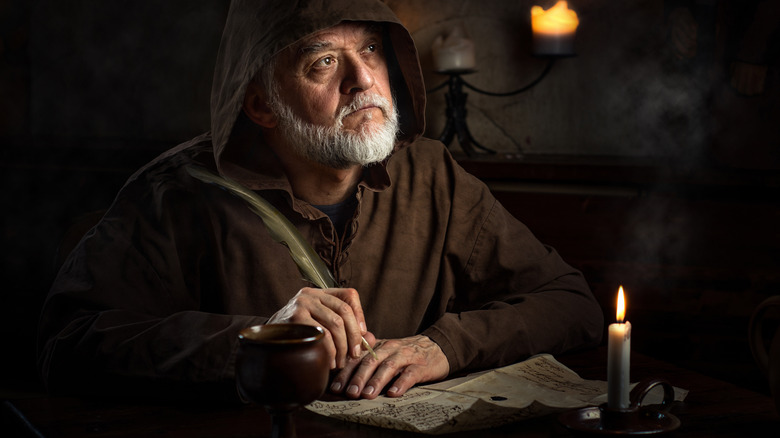 medieval monk writing letter