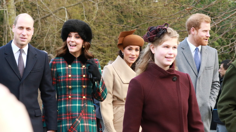 British royal family walking outside smiling at Christmas