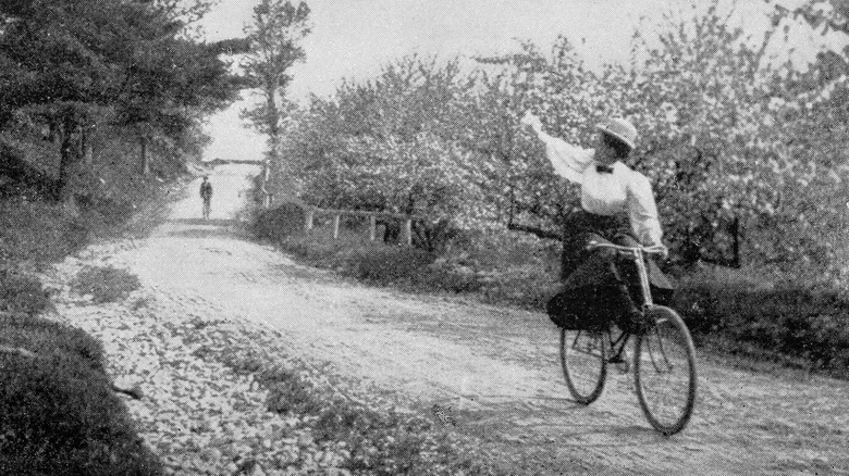 19th century woman and bicycle