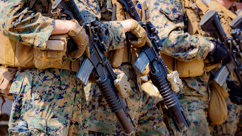 Army soldiers holding rifles