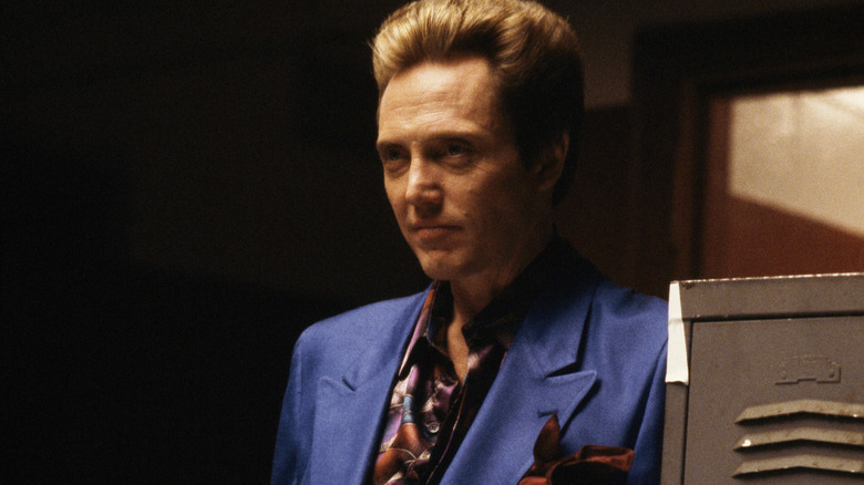 Christopher Walken leaning against wall