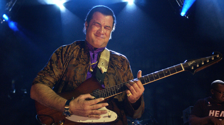 Steven Seagal playing guitar