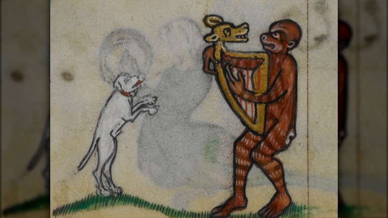 medieval manuscript of monkey with a harp