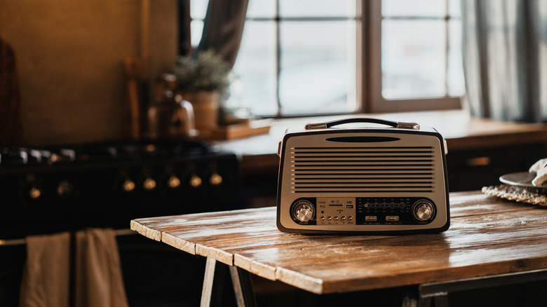 Old radio playing on table