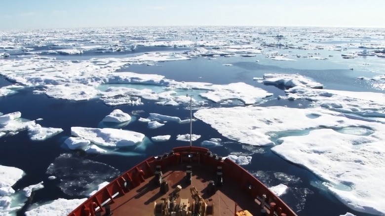 Ship moving through sea ice floes