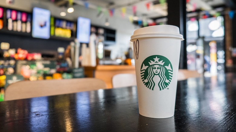 Starbucks cup on wooden table