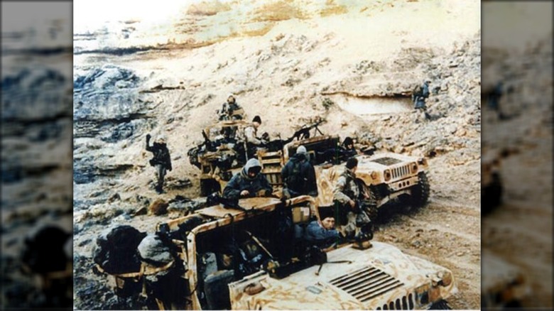 delta force operators at truck in war