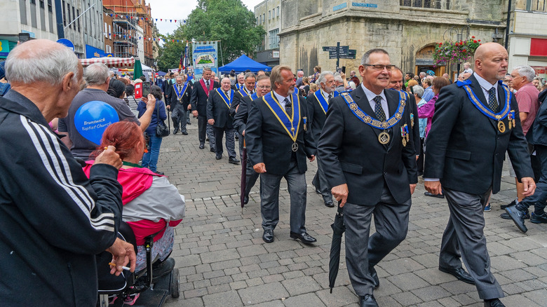 freemasons parading in commemoration of lifting of siege of gloucester