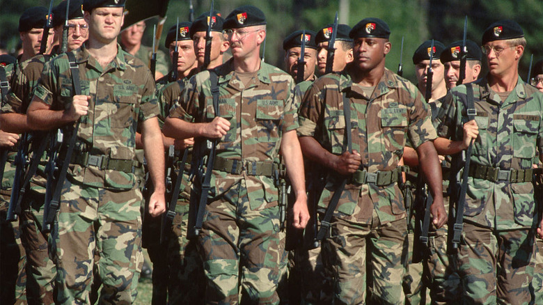 Green Berets marking with guns