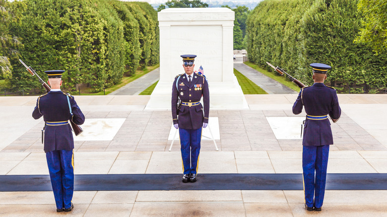 Three Guards standing in front of the Tomb