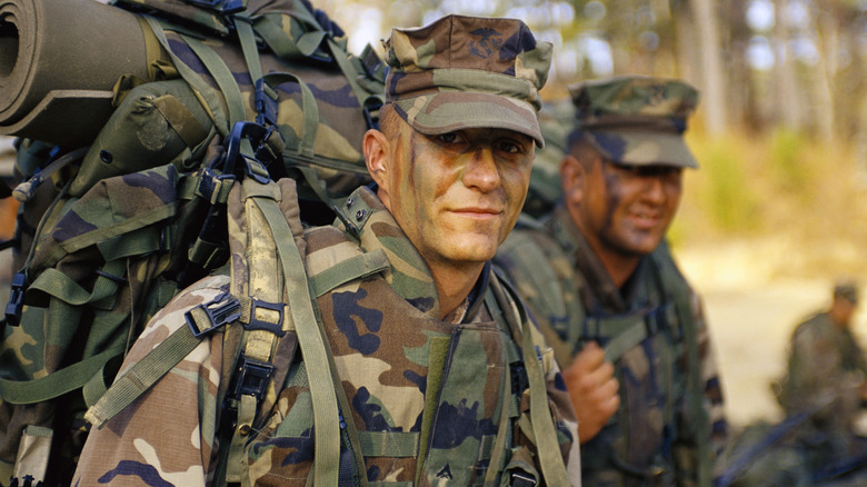 Marines march in camouflage gear