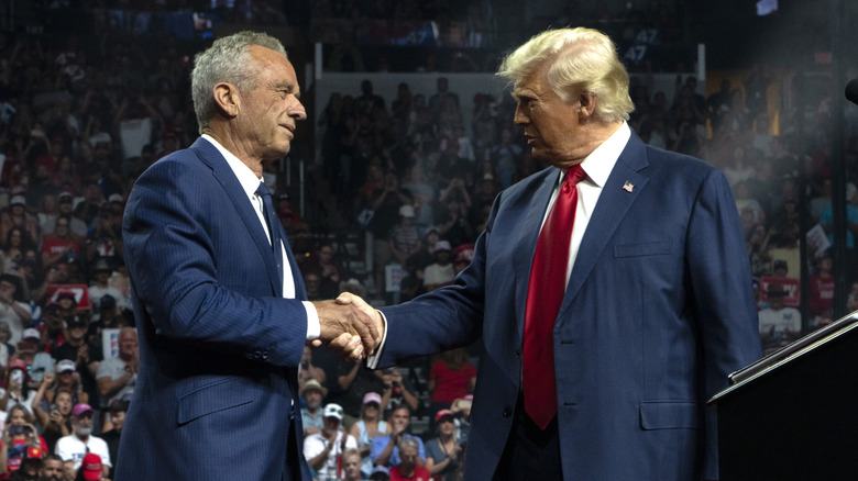 Robert Kennedy Jr. and Donald Trump shaking hands on stage