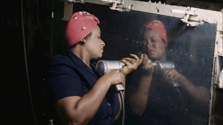 A woman performs war work in an American factory.