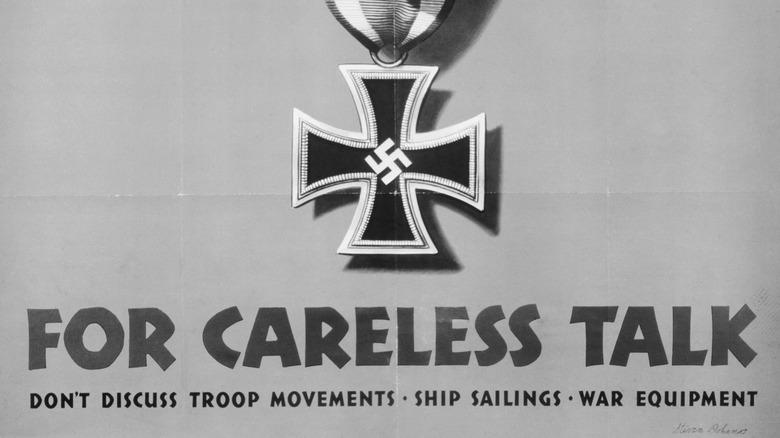 Crop a propaganda poster shows Iron Cross and swastika