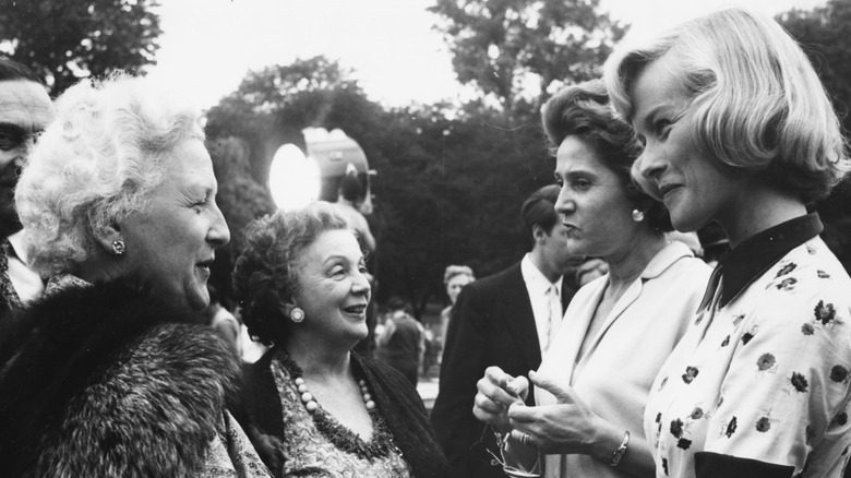 Former resistance fighters socialize at Kensington Gardens.