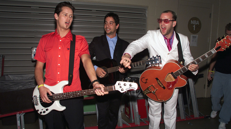 Murphy Karges, Rodney Sheppard, and Stan Frazier holding guitars