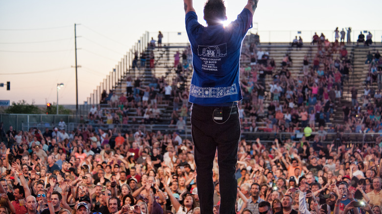 Mark McGrath on stage in front of a crowd