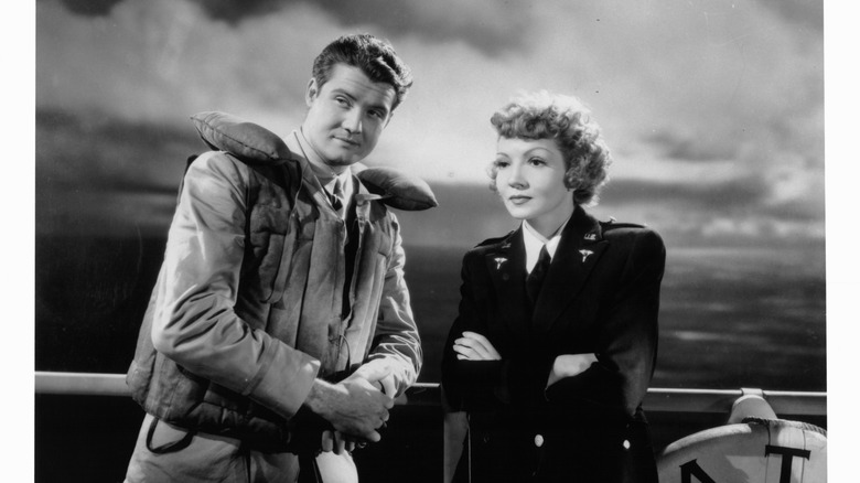 George Reeves standing Claudette Colbert ship