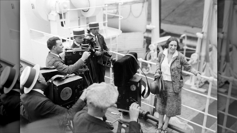 Suzanne Lenglen being interviewed on a ship