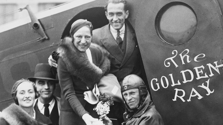 Suzanne Lenglen getting on a plane with her fiance