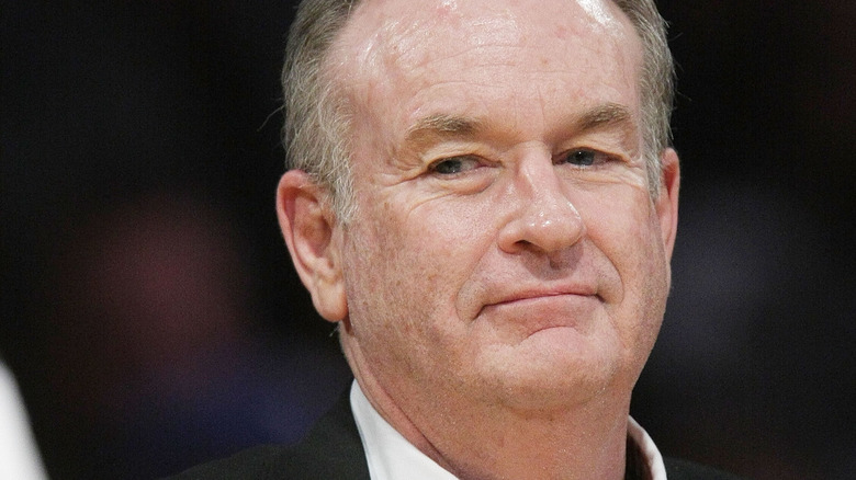 Bill O'Reilly smirking at basketball game