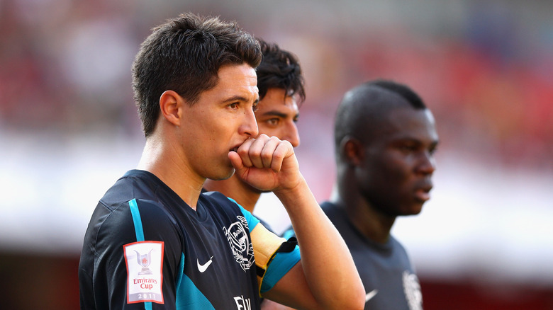 Emmanuel Frimpong and Samir Nasri playing soccer