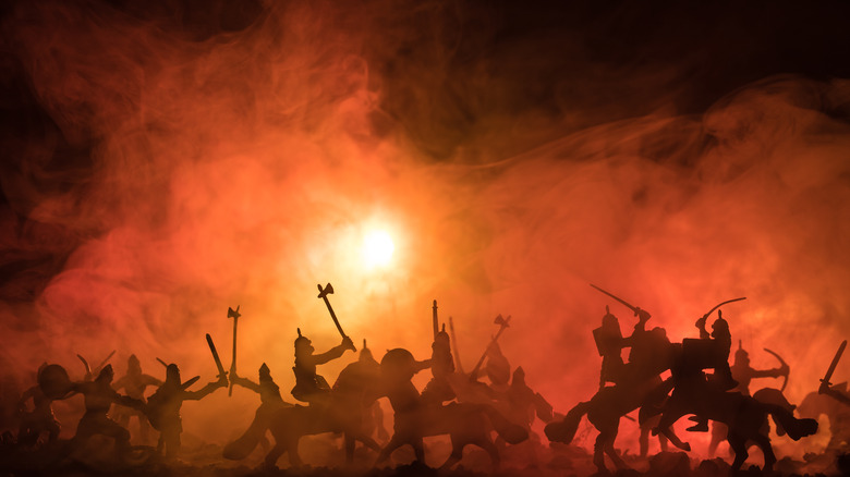 Silhouetted battle scene