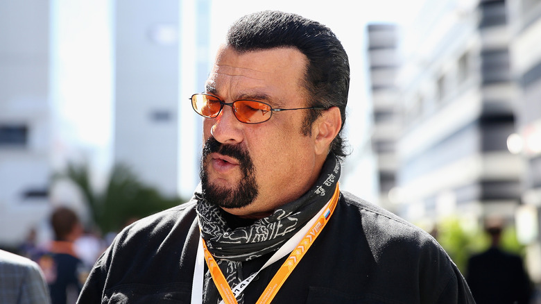 Steven Seagal in a bandana and sunglasses