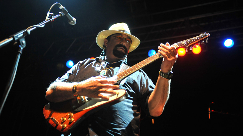 Steven Seagal playing guitar onstage