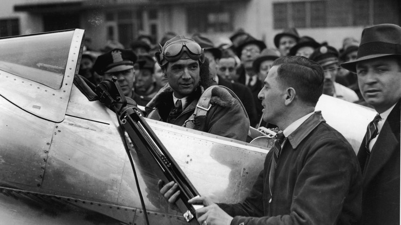 Howard Hughes sitting in plane