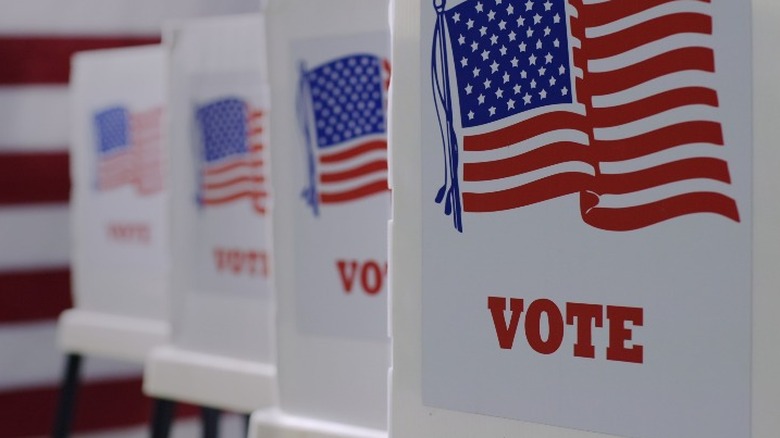 voting booths with American flags