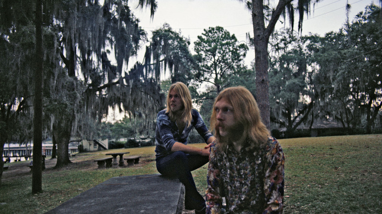 Duane and Gregg Allman in a park