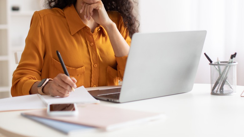 Person using laptop at desk