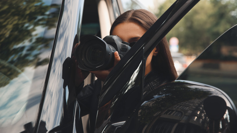 Woman sneaking photographs