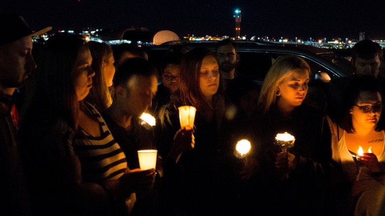 People at a vigil for the shooting