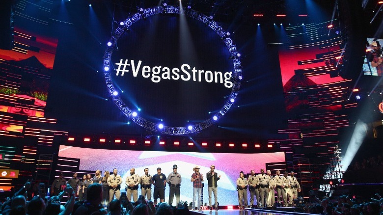 Police and Jason Aldean with #VegasStrong banner