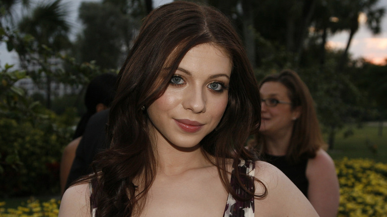 Michelle Trachtenberg posing outdoors